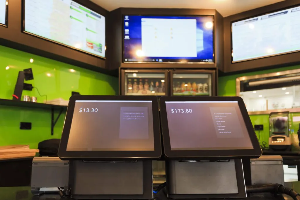 2 touchscreen customer facing tablets in a cafe taking orders and serving as smart POS terminals with printers for receipts